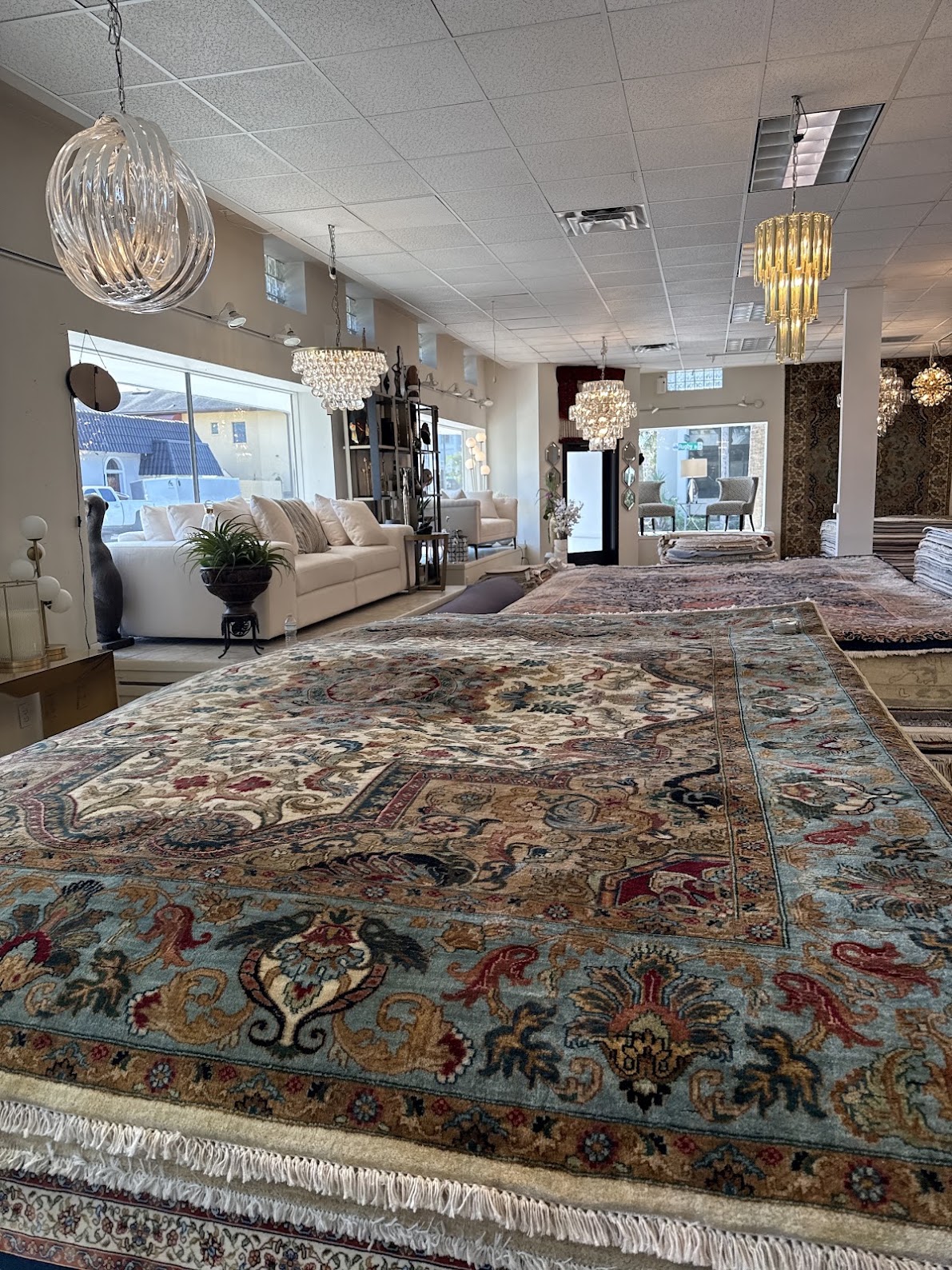 Blue and ivory floral rug displayed in the Diamond Rug Gallery showroom