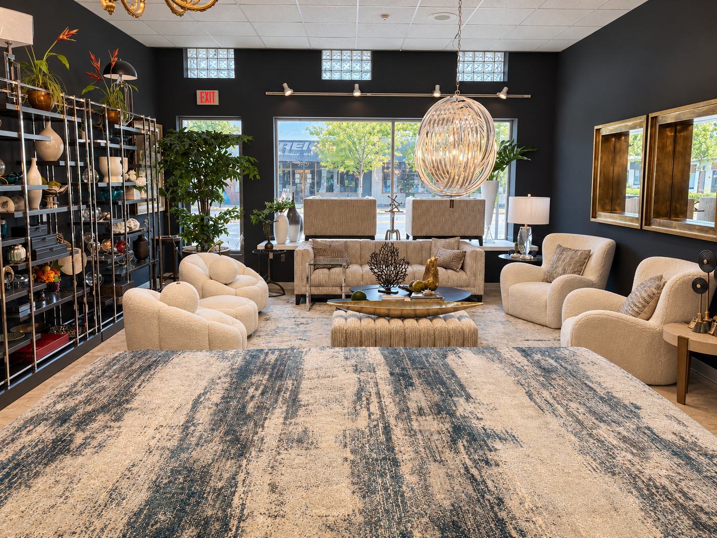 Cream seating arranged around a blue and ivory modern area rug in the Diamond Rug Gallery showroom